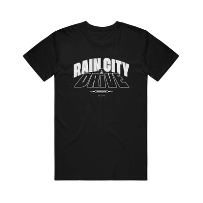 Rain City Drive black American Apparel T-shirt with bold white "RAIN CITY DRIVE" text in a stylized font on the chest, plus a small triangle and line under "DRIVE." A must-have for printed tee fans.